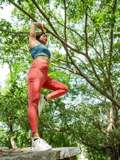 woman stretching in nature